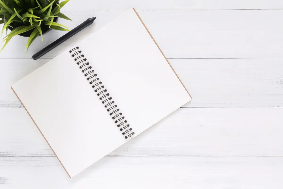 Otwarty notes z zapisami, ilustracja wyboru formy opodatkowania